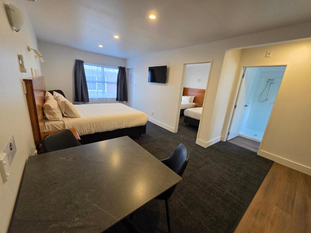 Family motel room with multiple beds