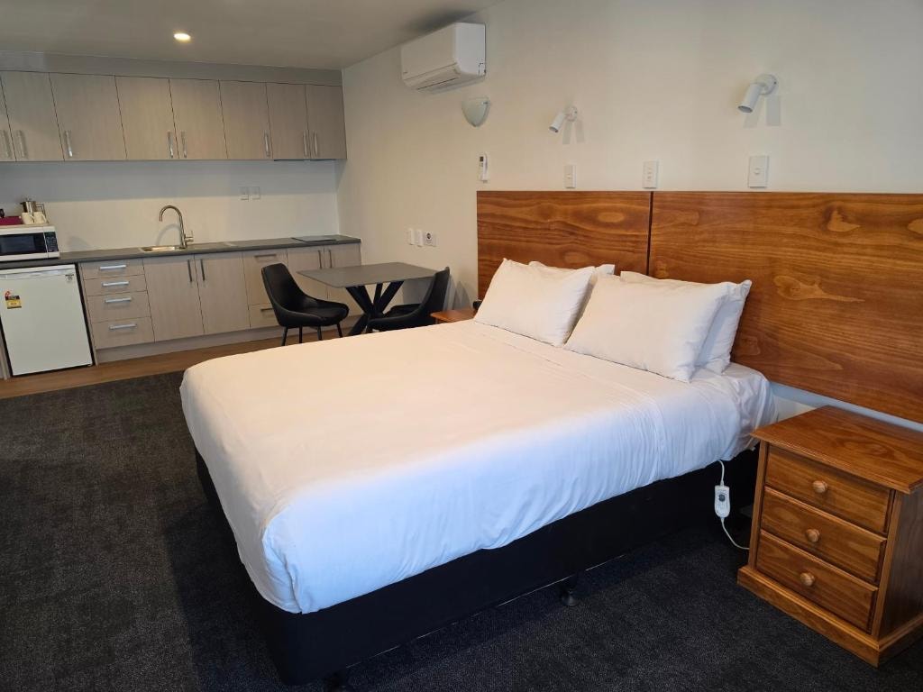 Standard motel room with comfortable queen bed