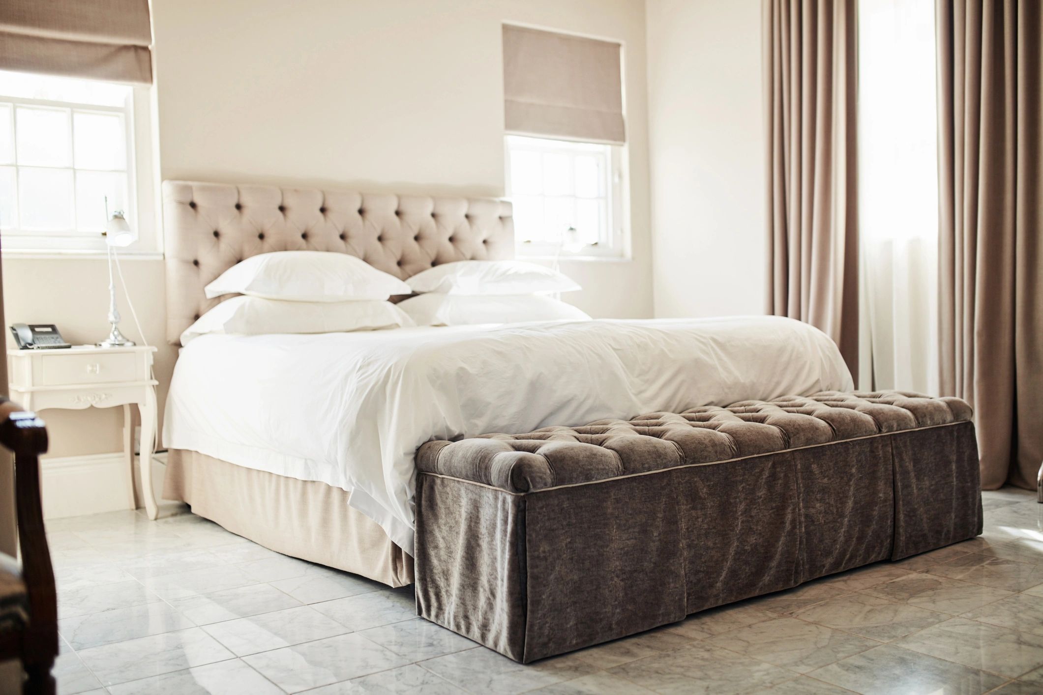 Comfortable bed with fresh linens in a modern room