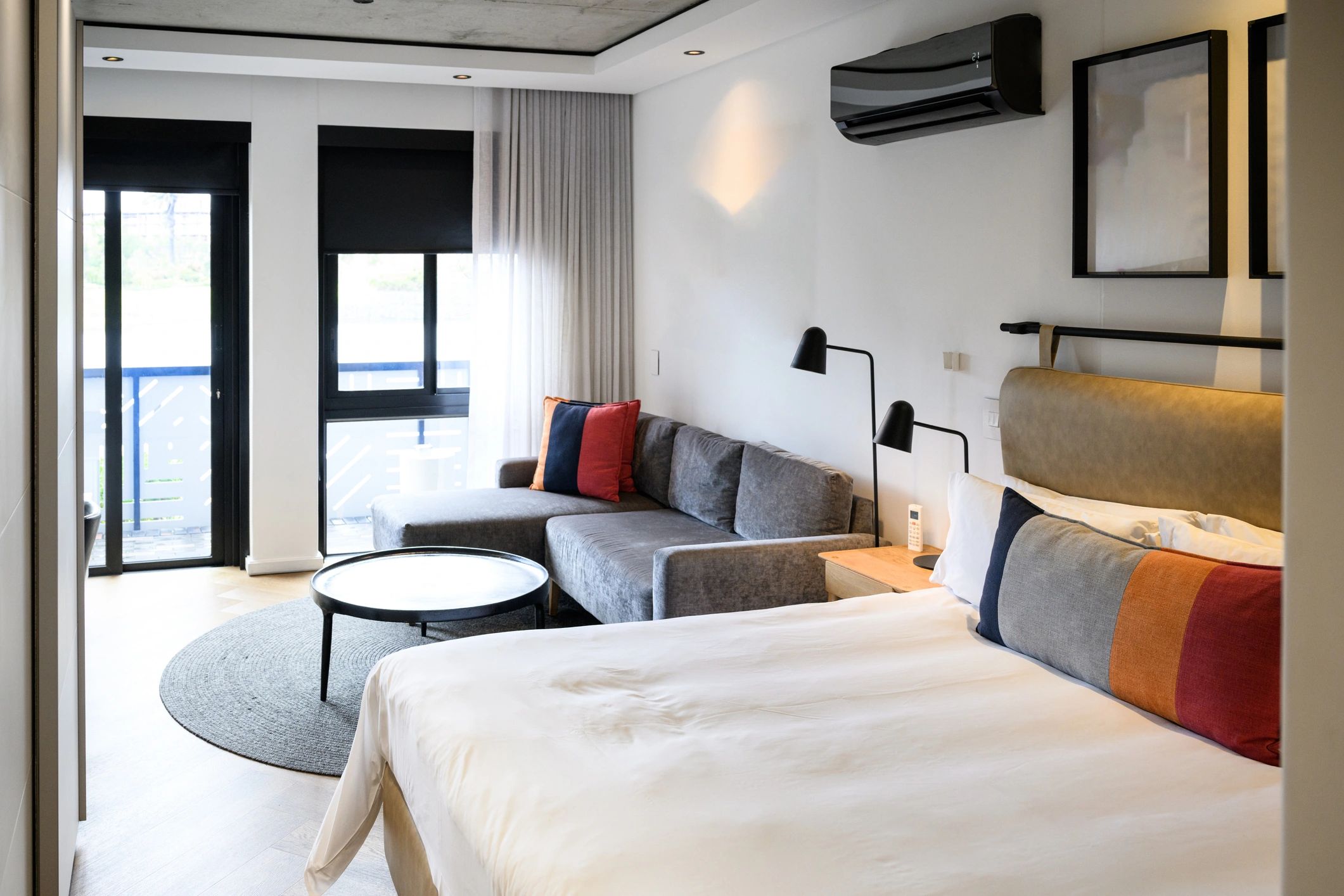 Contemporary motel room with soft daylight and modern furnishings